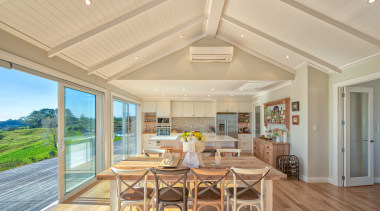 A soaring 2.7m tongue-and-groove ceiling sets off this timber ceiling, hardwood, home, house, interior design, living room, real estate, window, wood flooring, orange, open plan living,  fowler homes