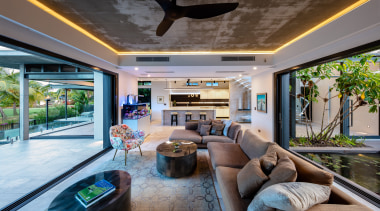 ​​​​​​​Stacker doors to the left, stacker doors to estate, home, house, interior design, living room, lobby, real estate, gray