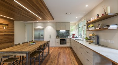 Renovation creates large open-plan living space and opens cabinetry, countertop, bencthop, Resene, floor, flooring, hardwood, interior design, kitchen, wood, wood flooring, Higham Architecture, plywood