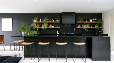 Paint choices help downplay on-view kitchen’s functionality furniture, home, interior design, kitchen, living room, table, white, black