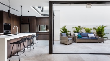 This clean-lined kitchen forms part of a whole-house floor, interior design, living room, white, gray