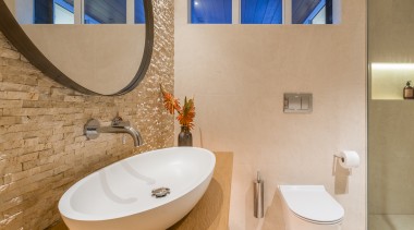 ​​​​​​​For this powder room and guest bathroom by bathroom, interior design, plumbing fixtures, sink, tap, tiles, toilet, Natalie Du Bois, Resene, tapware, Progetto, Travertine, Limestone