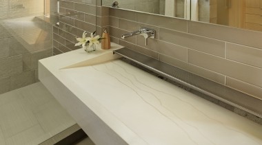 ​​​​​​​This custom-designed sink was cast in glass fibre bathroom, countertop, tiled floor, custom made sink, tap, Cheng Design