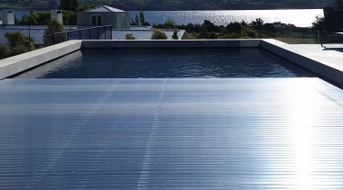 ​​​​​​​Roll Out Roll Under slatted covers are a reflection, reservoir, water, covers 4 pools, swimming pool
