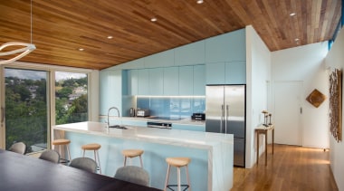 ​​​​​​​Finished in powder blue and defined by the architecture, ceiling, countertop, floor, house, interior design, table, wood, gray, brown, timber floor, Frans Kamermans