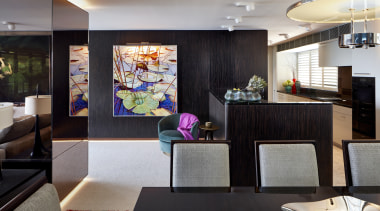 ​​​​​​​In the living area of this apartment, a architecture, design, floor, furniture, home, house, interior design, living room, table, wall, black, gray, paintings, Richard Archer Design
