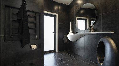 ​​​​​​​For this bathroom by designer Celia Visser, the architecture, bathroom, floor, flooring, tiles, home, house, plumbing fixtures, black, Vanity