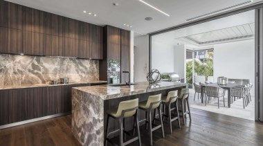 ​​​​​​​While the LED strip ceiling lighting is understated architecture, cabinetry, countertop, benthtop, design, dining room, floor, flooring, furniture, hardwood, home, house, interior design, kitchen, dining table, wood flooring, marble, Studio Italia