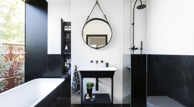 This contemporary bathroom, located in a modest space, architecture, bathroom, black, black-and-white, floor, plumbing fixture, sink, tap, tile, white, black, freestanding tub, round mirror, Minosa, Darren Genner