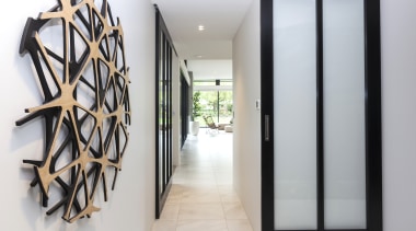 The entry to this home features serene shoji-like, architecture, door, interior design, entrance, shoji doors, wall sculpture, Don Service, O'Neil Architecture