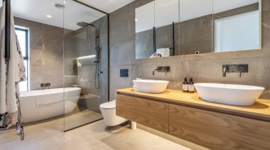 ​​​​​​​Two curvaceous white top-mounted vanity basins connect with architecture, bathroom, bathtub, ceramic tiles, floor, home, house, interior design, plumbing fixture, tap, tile, top mounted vanities, QPC, Elite Bathroomware