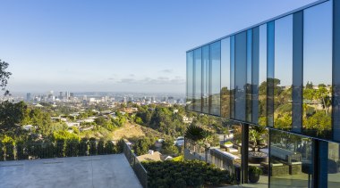​​​​​​​The custom designed glass curtain wall on this architecture, facade, curtain wall, home, house, landscape, residential, tree, urban area, SPfa