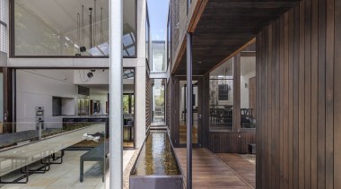 ​​​​​​​While the water running between the two wings home, architecture, courtyard, facade, home, house, interior design, two wing home, CplusC Architectural Workshop