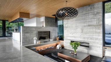 ​​​​​​​The home’s tilt slab concrete walls have a architecture, building, ceiling, concrete, design, floor, flooring, furniture, home, house, interior design, living room, lobby, property, real estate, room, table, tile, wall, gray