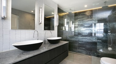 ​​​​​​​An open shower stall, backed in metallic, large-format architecture, bathroom, bathtub, building, ceiling, floor, flooring, furniture, home, house, interior design, material property, plumbing fixture, property, real estate, room, sink, tap, tile, gray, white
