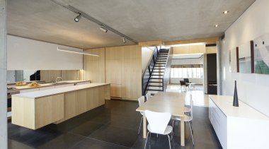 This kitchen by architect David Haseler has everything apartment, architecture, building, cabinetry, ceiling, countertop, design, floor, flooring, furniture, home, house, interior design, kitchen, loft, property, real estate, room, table, tile, wall, gray