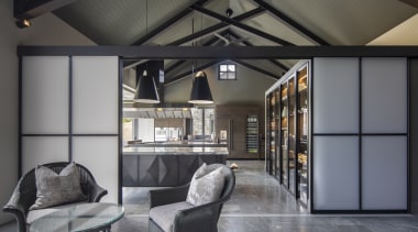 ​​​​​​​Japanese-look screens part to reveal this industrial-look kitchen gray, black