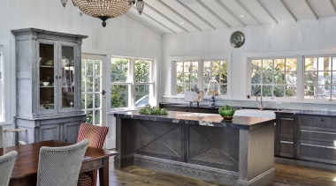 ​​​​​​​The island in this traditional includes classic detailing gray