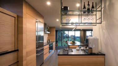 ​​​​​​​Extensive storage in this kitchen comes via a brown