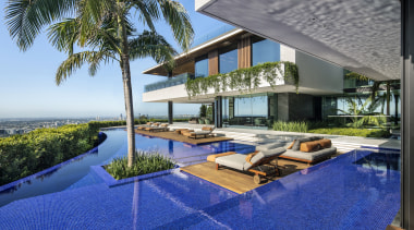 ​​​​​​​An infinity edge pool sits between the two 