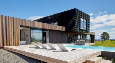 A larch batten exterior rain screen encases the 