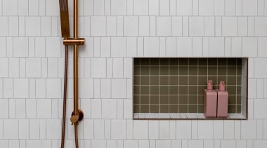 The shower hardware matches the vanity tapware for 