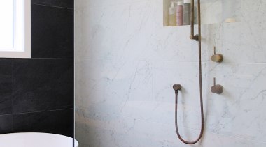 The living finish aged brass tapware is on-trend, gray