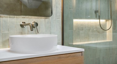 The ensuite celebrates natural tones. - When a 