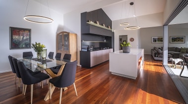 The timber floored living, kitchen and dining areas 