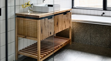 The warm-look vanity is created in local hardwood. 