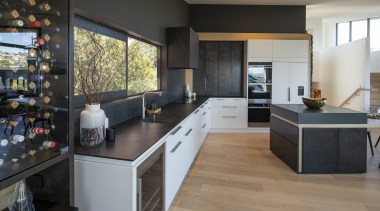 The kitchen is located to the side of 