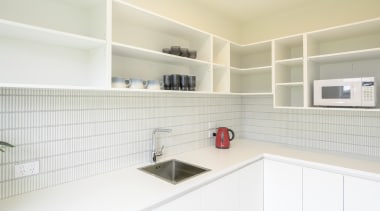 The white, bright and spacious walk-in scullery. 