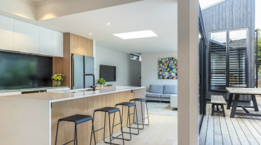 The small galley kitchen was demolished and replaced 