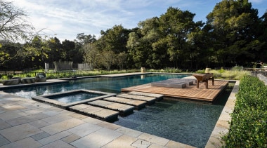 Pool and spa pool with pavers leading to 