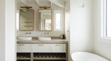 The double vanity feature an open towel storage 