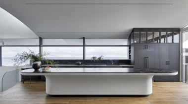 The kitchen island has its own nautical accent. 