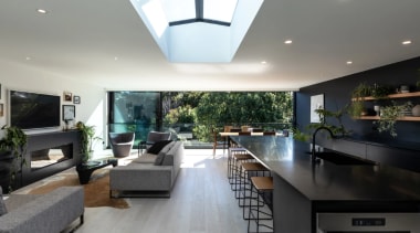 Bold kitchen features Fisher & Paykel appliances - apartment, architecture, building, cabinetry, ceiling, countertop, design, estate, floor, flooring, furniture, home, house, interior design, kitchen, lighting, living room, property, real estate, room, table, gray, black