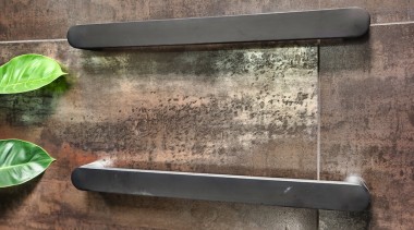 Brushed steel towel rails work well with the 