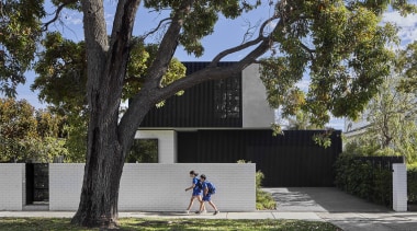 From the street, the comprehensively renovated home presents 