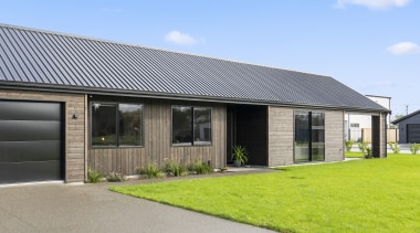 The double garage door provides subtle contrast to 