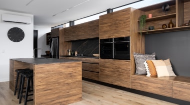 The substantial timber kitchen cabinetry is matched with 