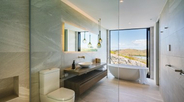 ​​​​​​​Taken from within the glass walled shower enclosure, gray