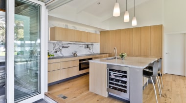 Bi-fold doors complete the servery window. - Surface 