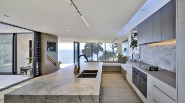 The kitchen is open to a sheltered outdoor 