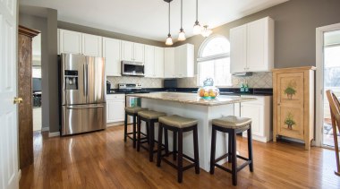 The kitchen floor is one of the most cabinetry, countertop, cuisine classique, floor, flooring, hardwood, interior design, kitchen, laminate flooring, real estate, room, wood, wood flooring, white