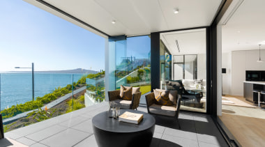 Sweeping views from this Mission Bay apartment include apartment, architecture, balcony, building, ceiling, design, estate, floor, furniture, home, house, interior design, living room, penthouse apartment, property, real estate, room, gray