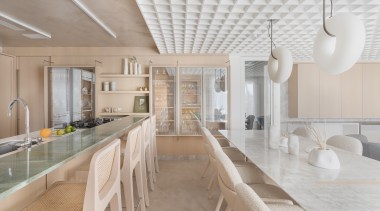 In the kitchen area, there is a glass 