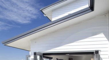 View of the exterior and a blue sky architecture, daylighting, facade, home, house, property, real estate, residential area, roof, window, blue, gray