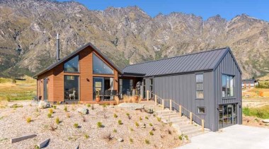 Easy family living is hte priority for this cottage, elevation, farmhouse, home, house, hut, landscape, log cabin, mountain, property, real estate, shed, gray, white