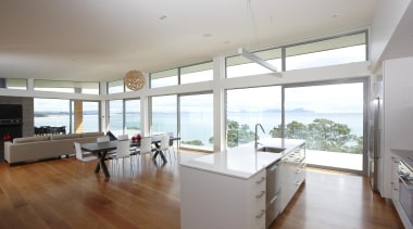 Open plan living in an amazing seaside setting. architecture, daylighting, floor, flooring, hardwood, house, interior design, kitchen, property, real estate, window, wood flooring, gray